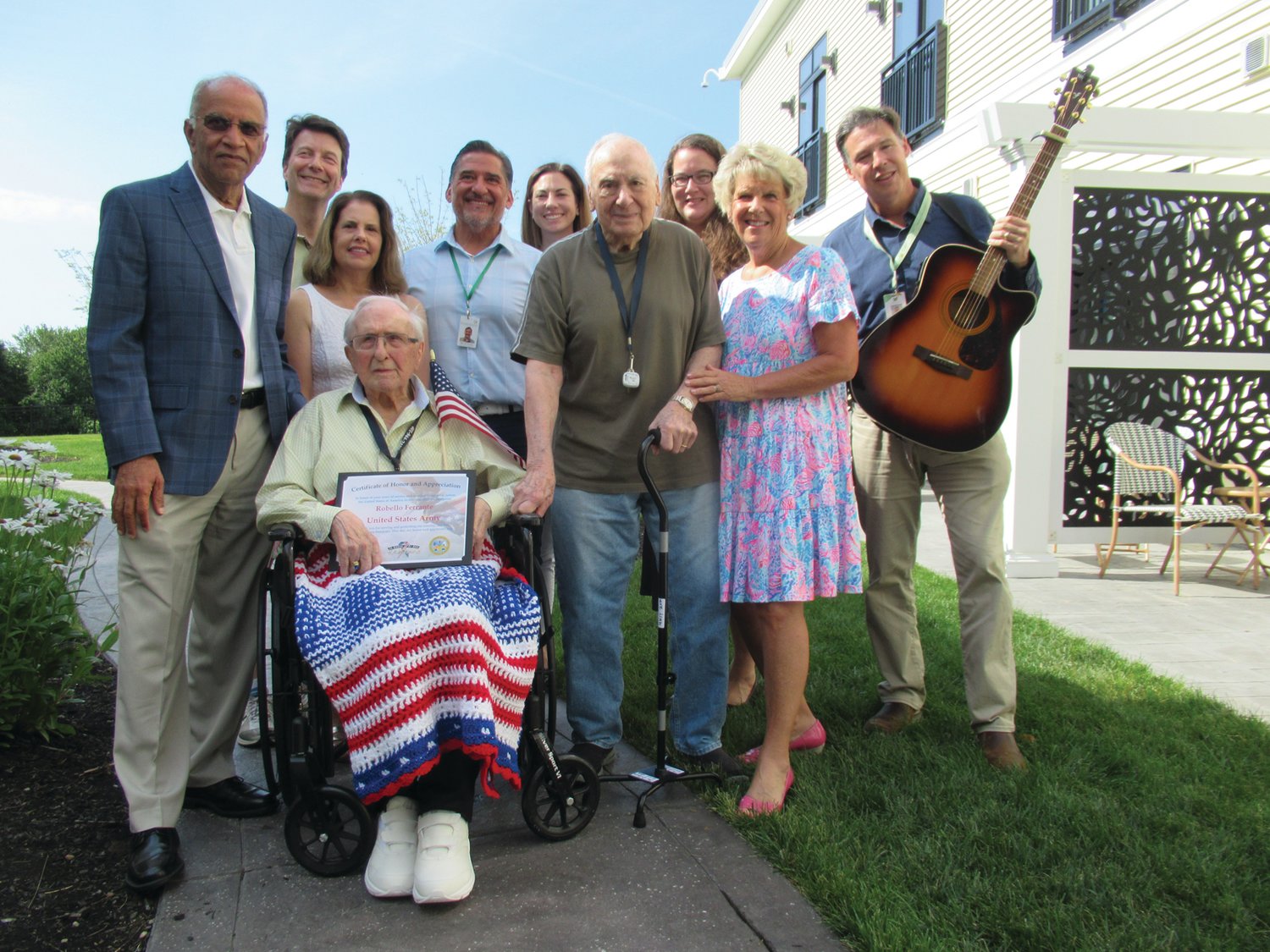 PRESERVE PALS: Akshay Talwar (left) owner of The Preserve at Briarcliffe, Maria Bermann, along with Hospice Officials surround legendary U.S. Army veteran Rebello Ferrante during a recent ceremony honoring the 98-year-old for his service to the country and successful working career.